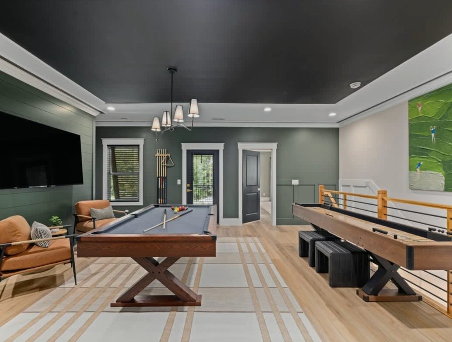 Game room with pool table and shuffleboard at the Birdie House
